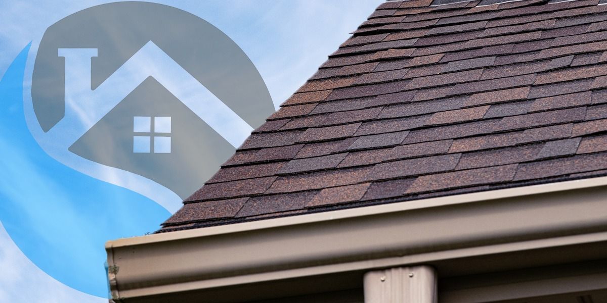 Brown roof with a light brown gutter and a logo of a house on a blue background.