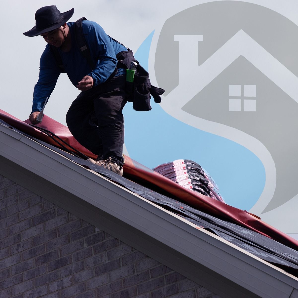 Roofer wearing hat, installing red roofing material on a house under a partly cloudy sky.
