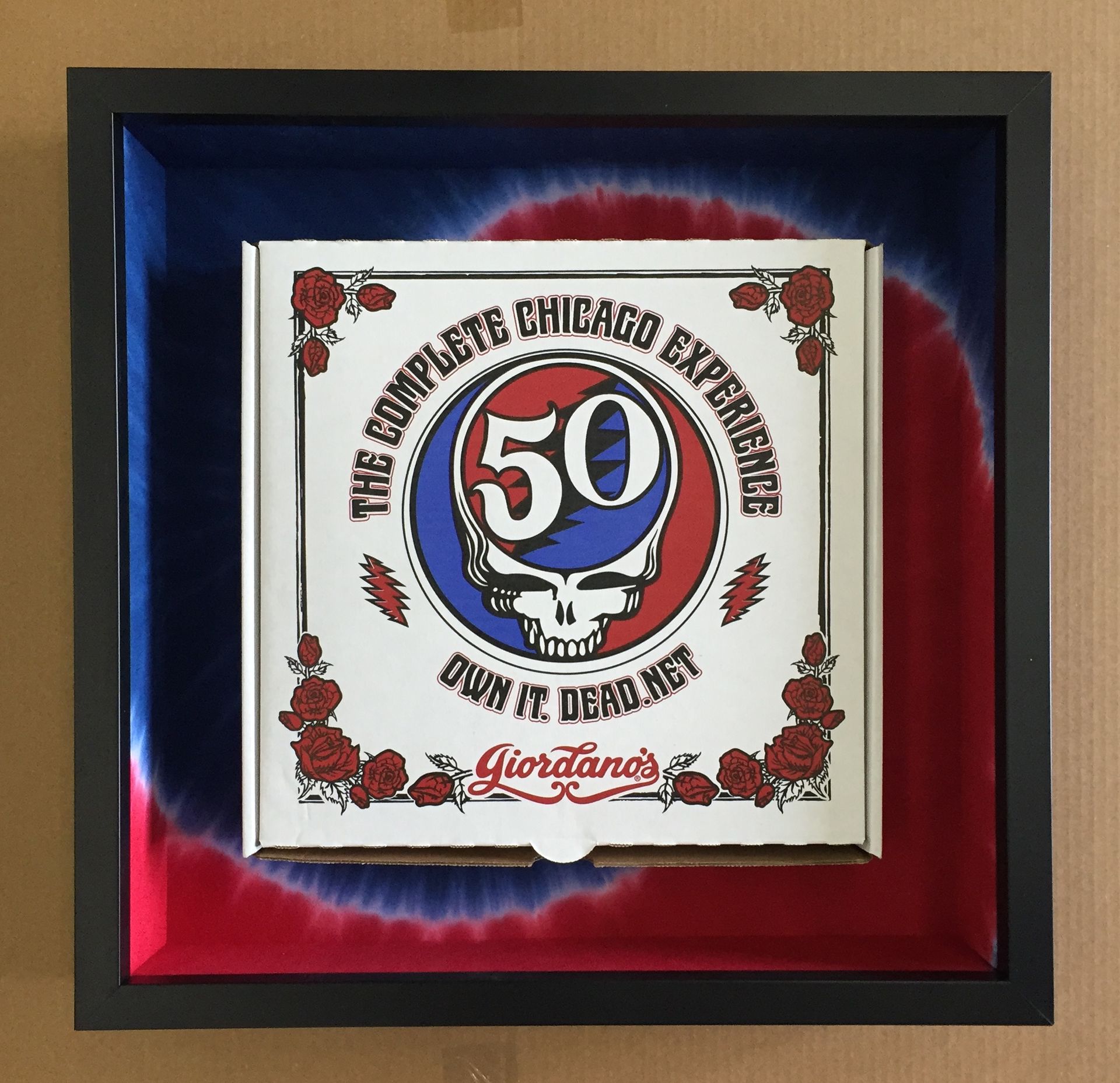 A pizza box with the number 50 on it