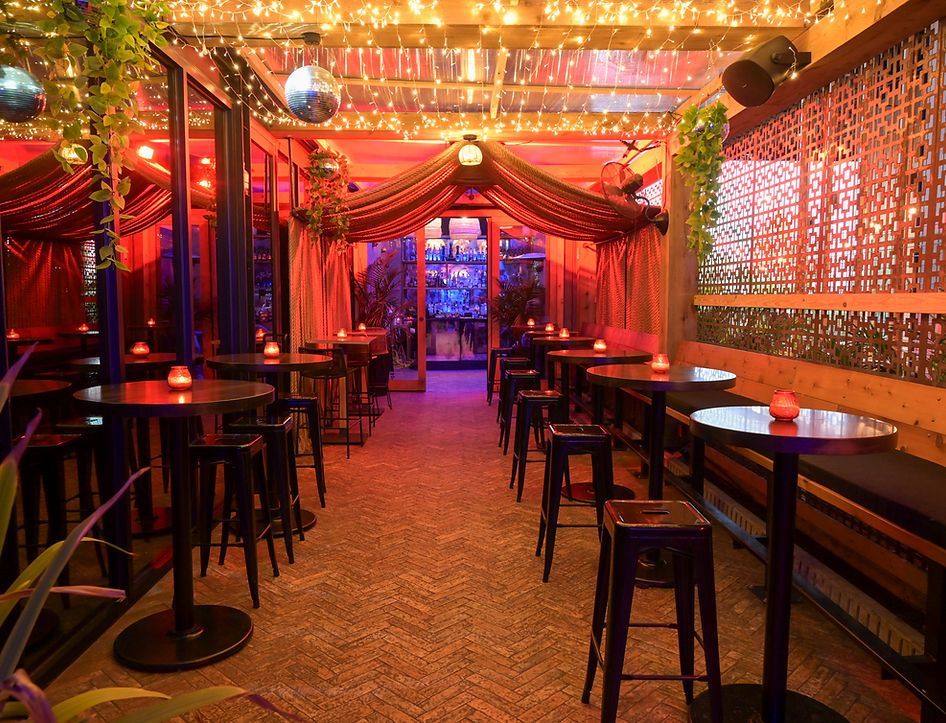 a restaurant with a lot of tables and stools