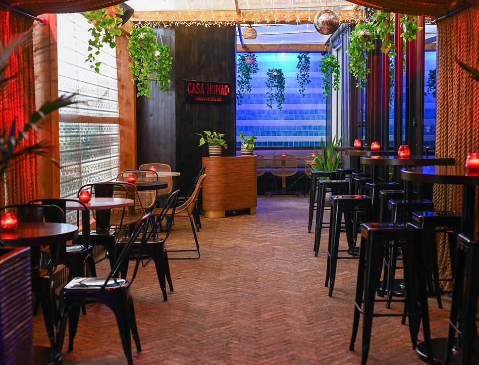 a restaurant with a lot of tables and chairs