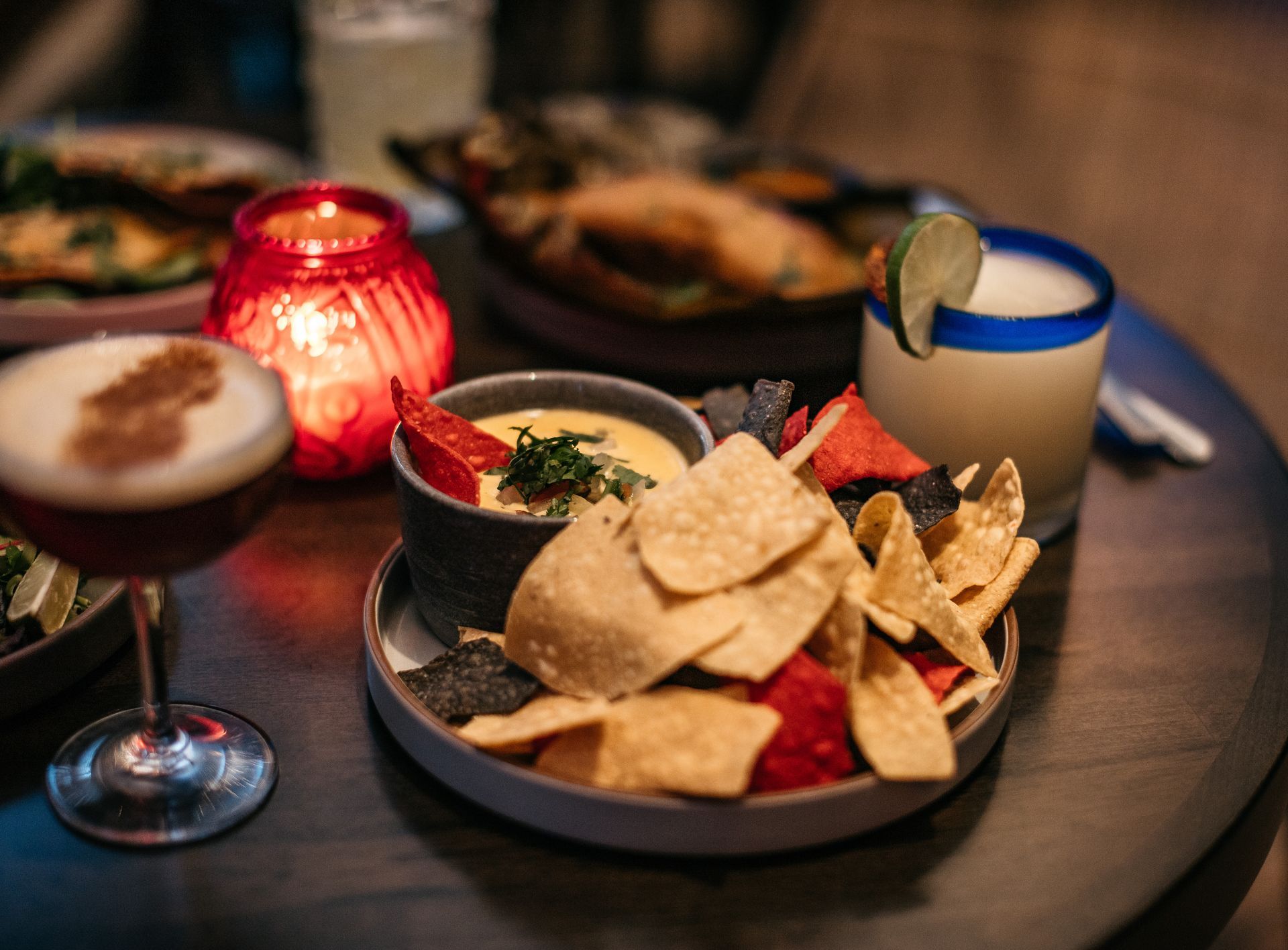 a wooden tray with food on a wooden table