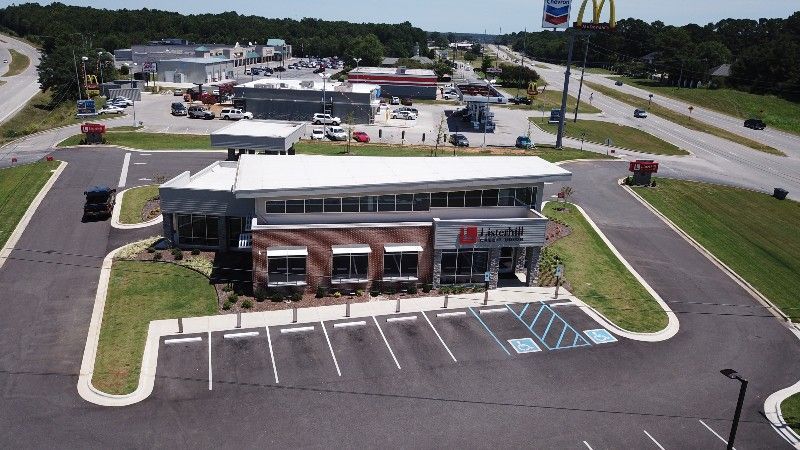 An aerial view of a mcdonald 's restaurant in a parking lot.