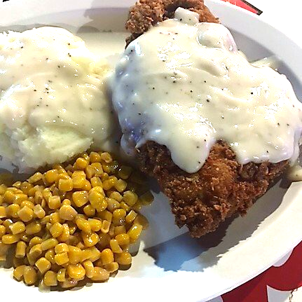 Fried chicken with mashed potatoes and corn