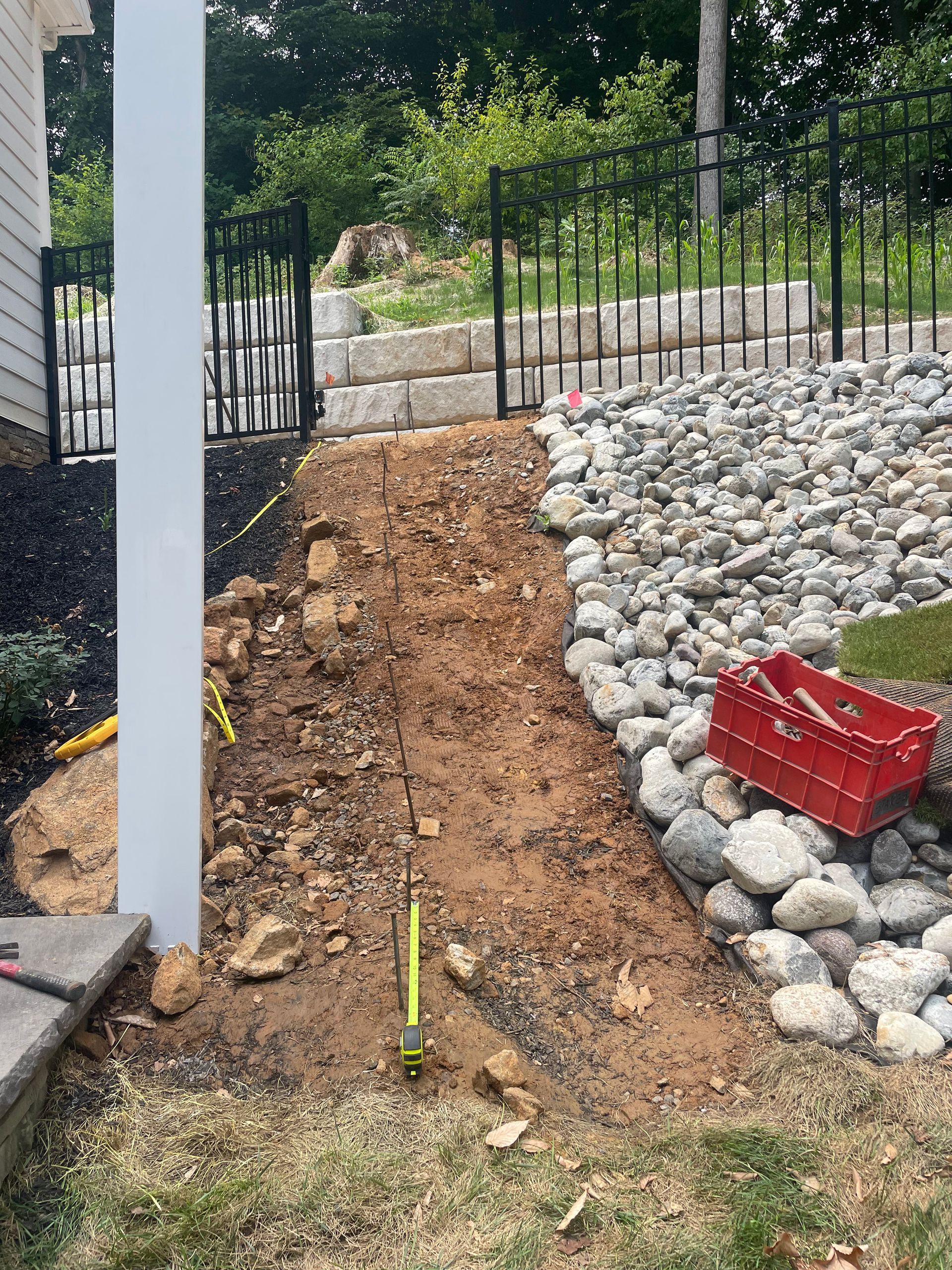 An rough incline leading up to a gate