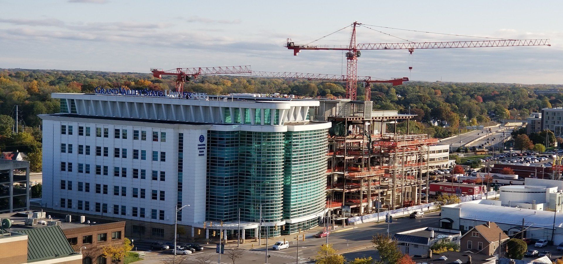 An aerial view of a building under construction in a city