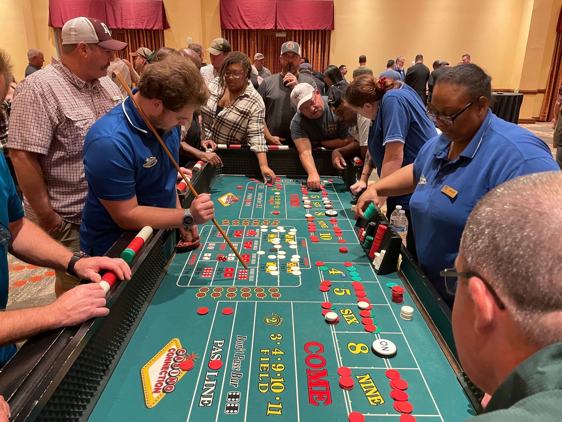 A group of people are playing a game of roulette in a casino.