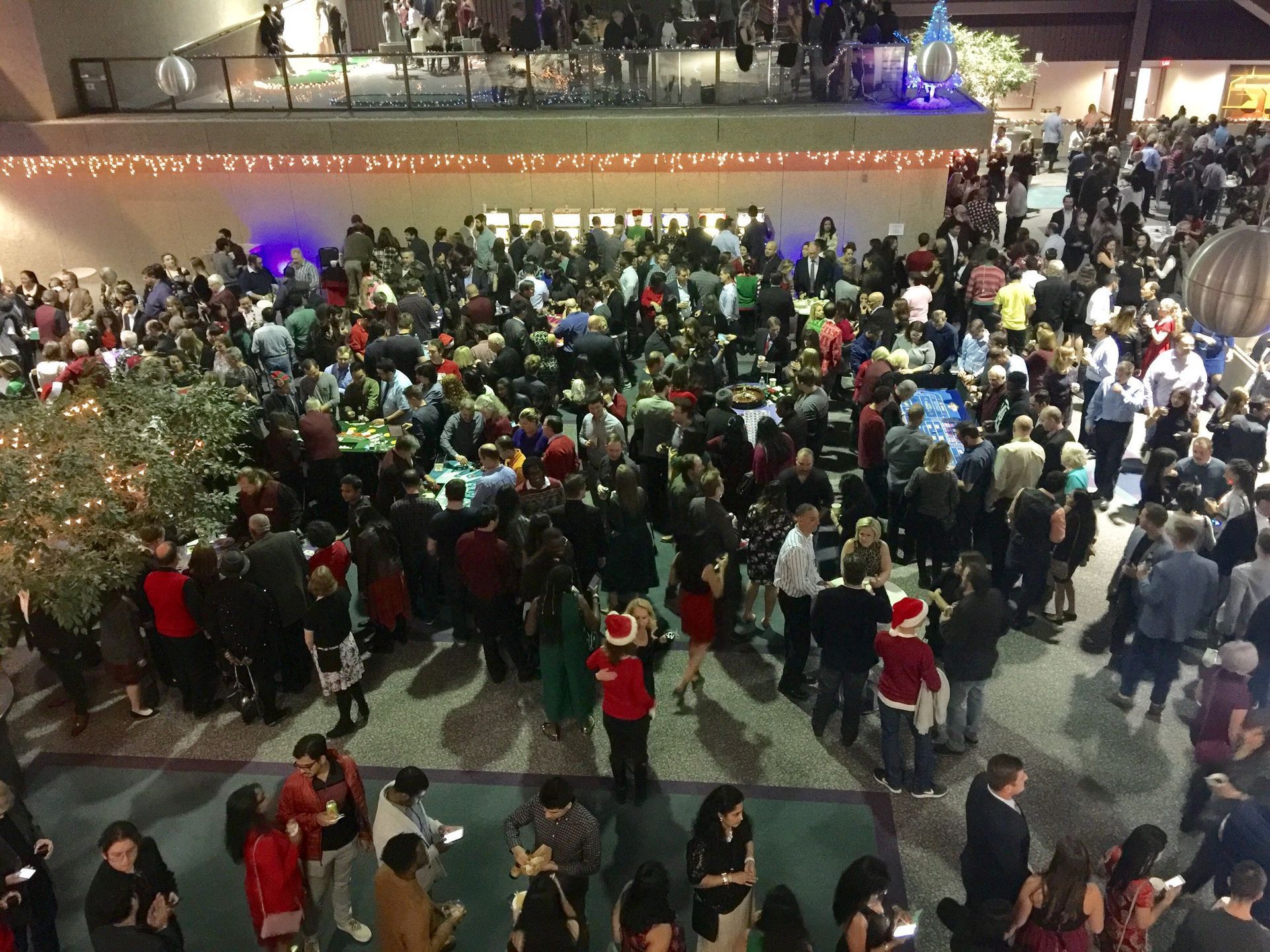 A large crowd of people are gathered in a large room