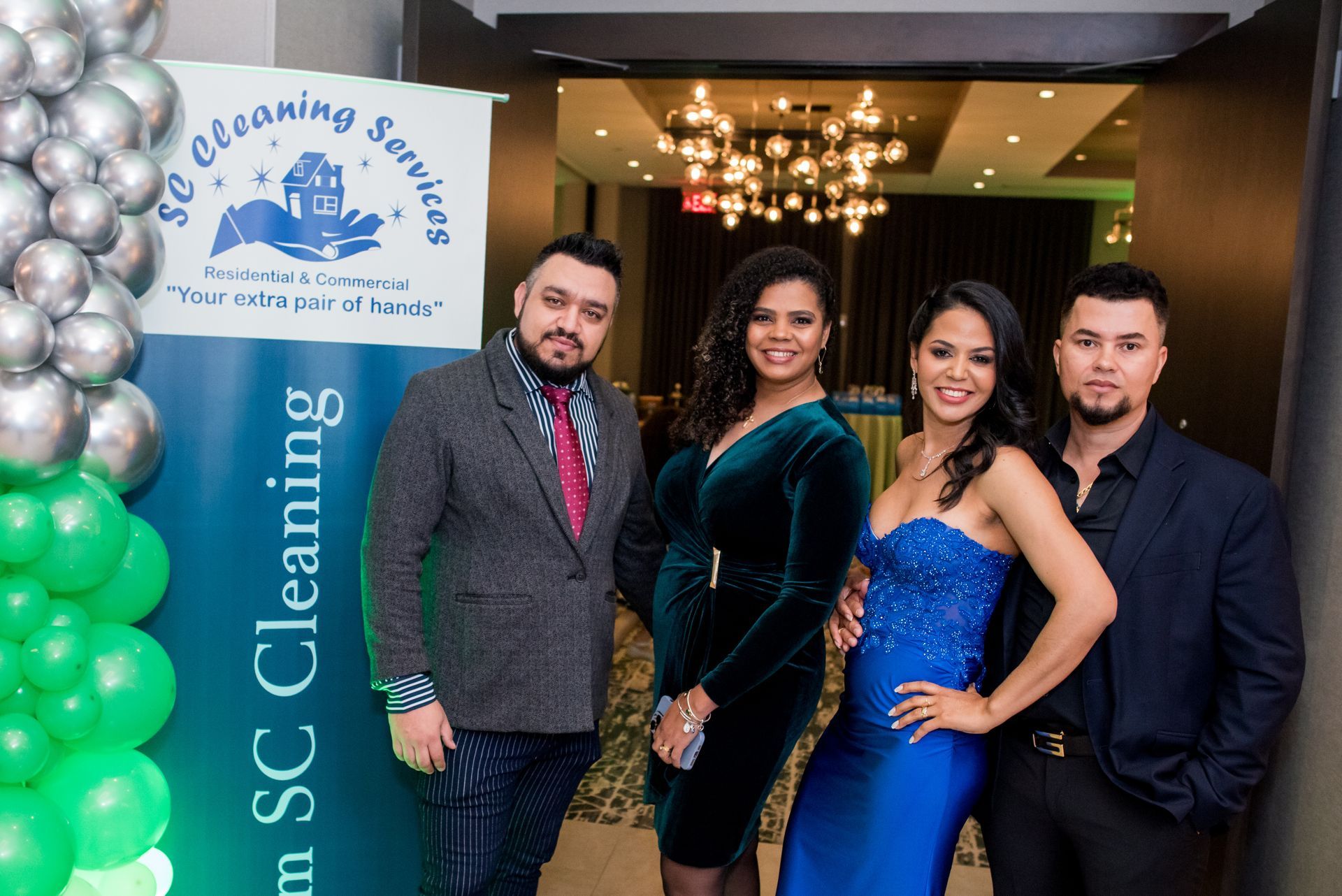 Four people pose near a