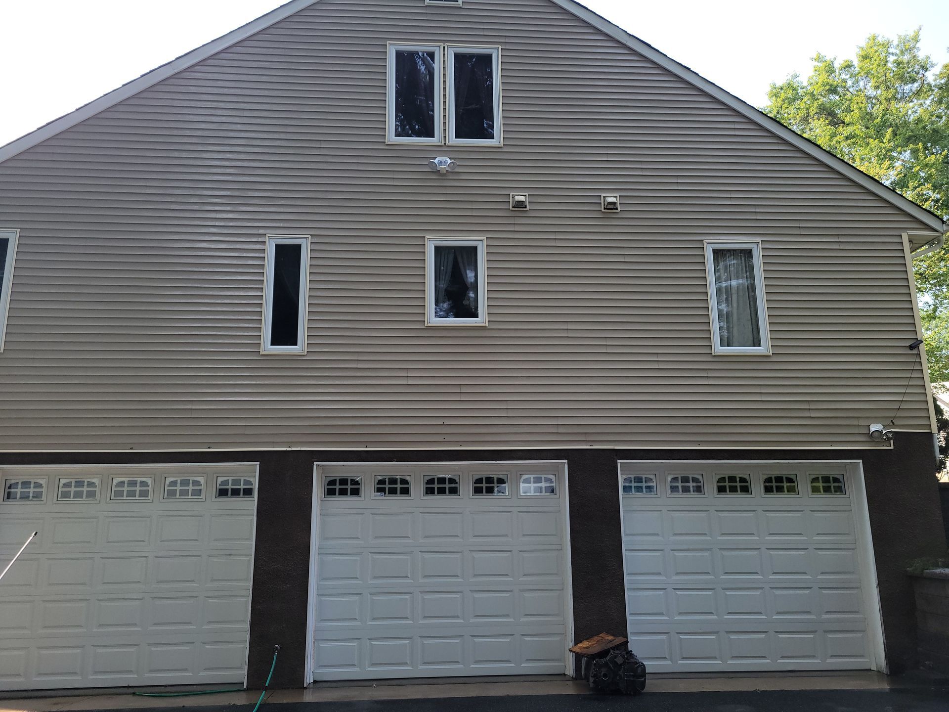 A house with a lot of garage doors and windows