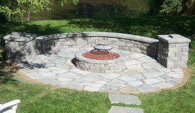 Flagstone Patio with fire-pit, columns & seat walls