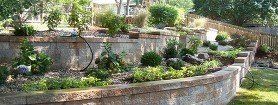 Landscaping with tiered retaining wall
