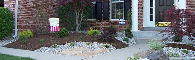 Front landscaping with stone edging