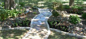 Rock garden landscaping with flagstone pathway