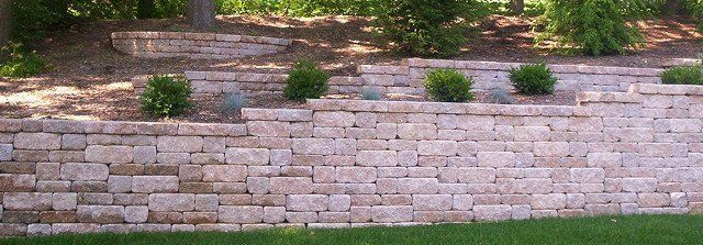Multi-level mosaic retaining wall with landscaping