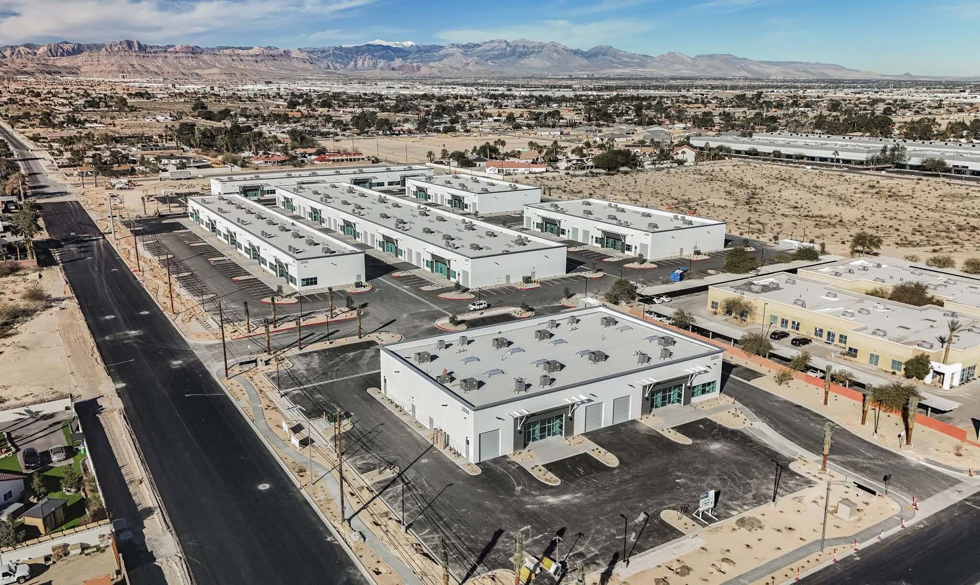 A six-building industrial development delivered from raw ground through tenant-ready warehouse and p