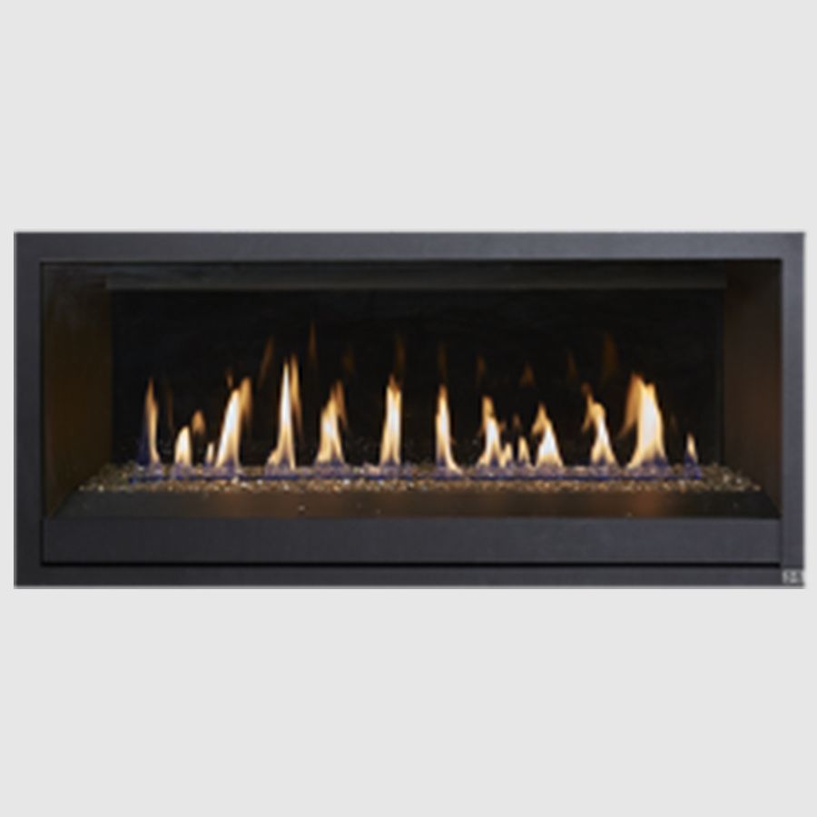 A fireplace with a lot of flames coming out of it.