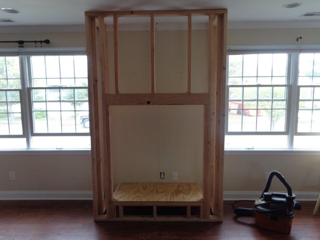 Construct framing for fireplace and venting.