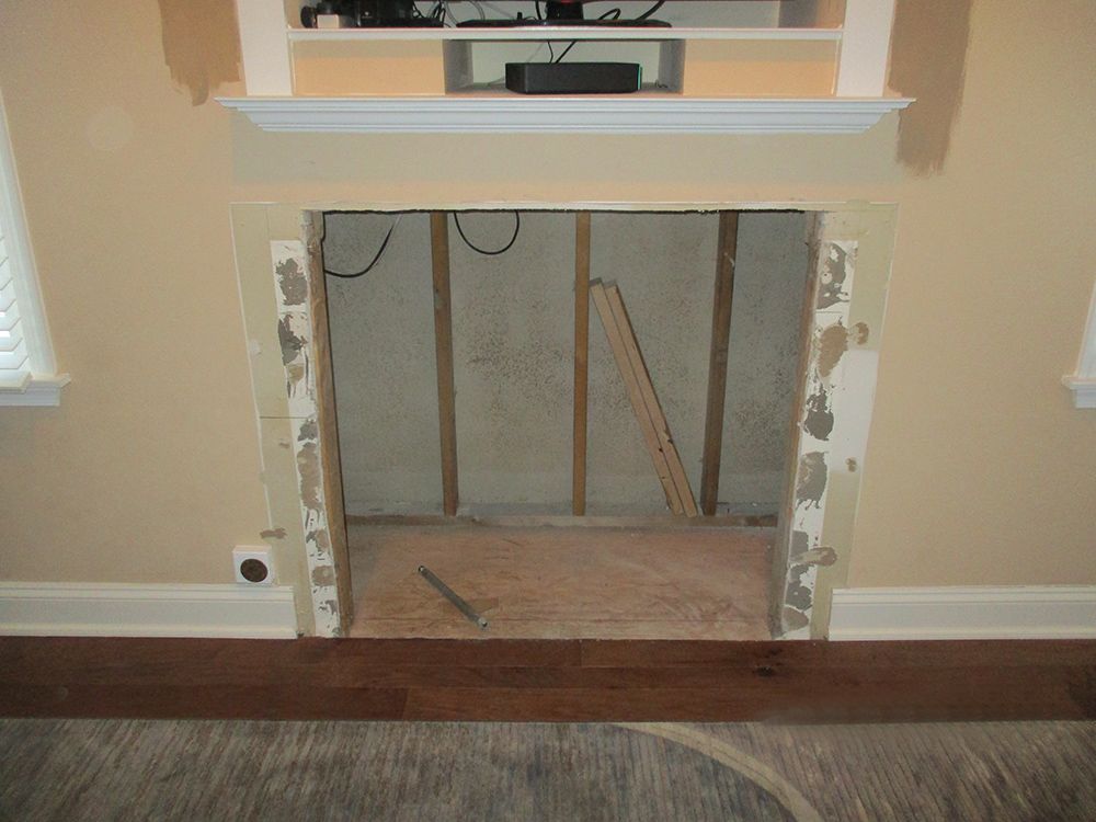 Rip out existing fireplace