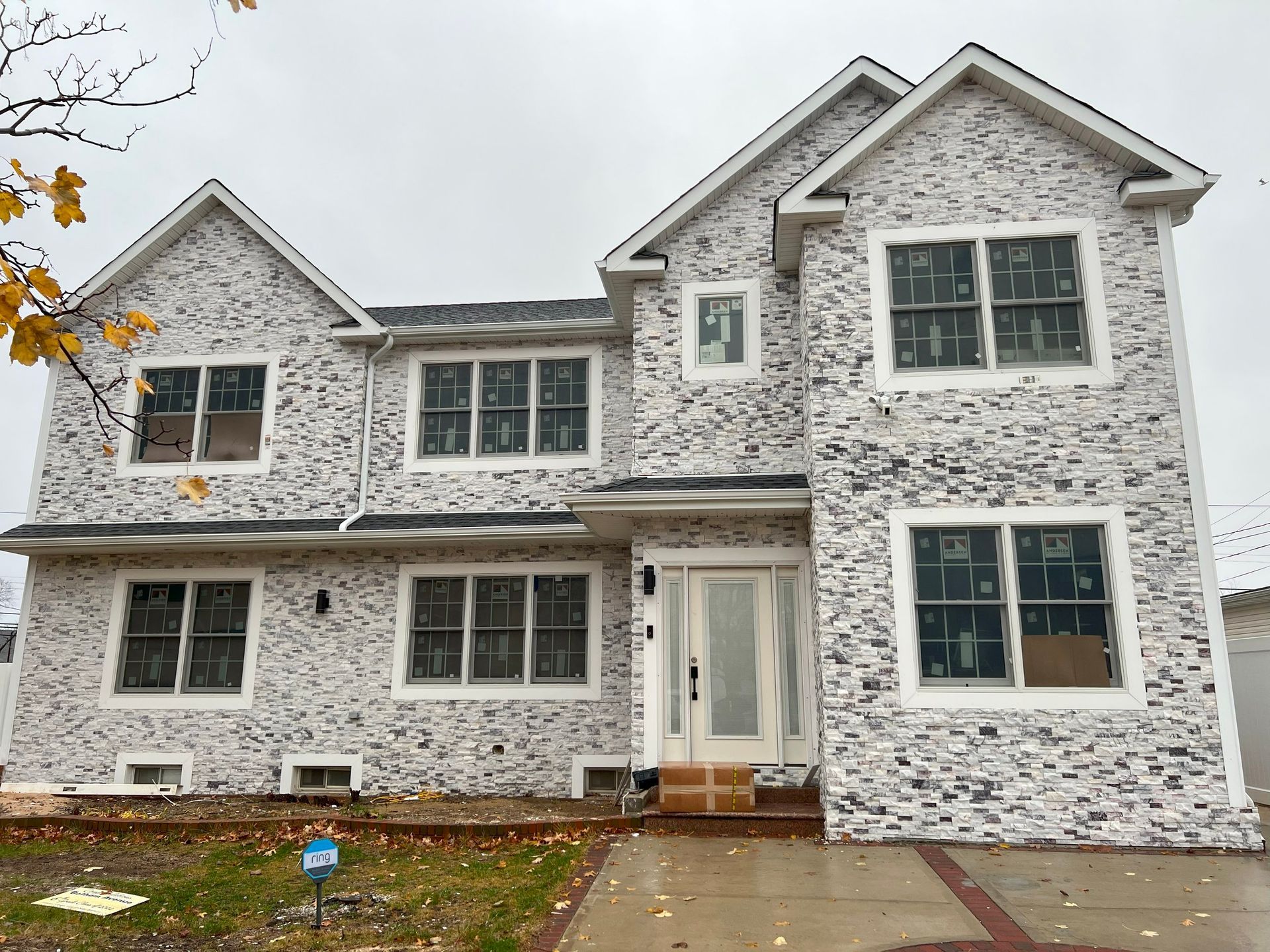 A large white brick house with a lot of windows