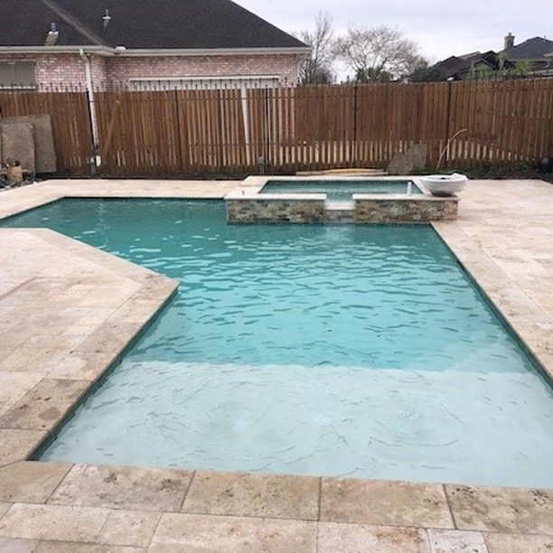 Modern geometric pool design with raised edge in Mandeville, LA