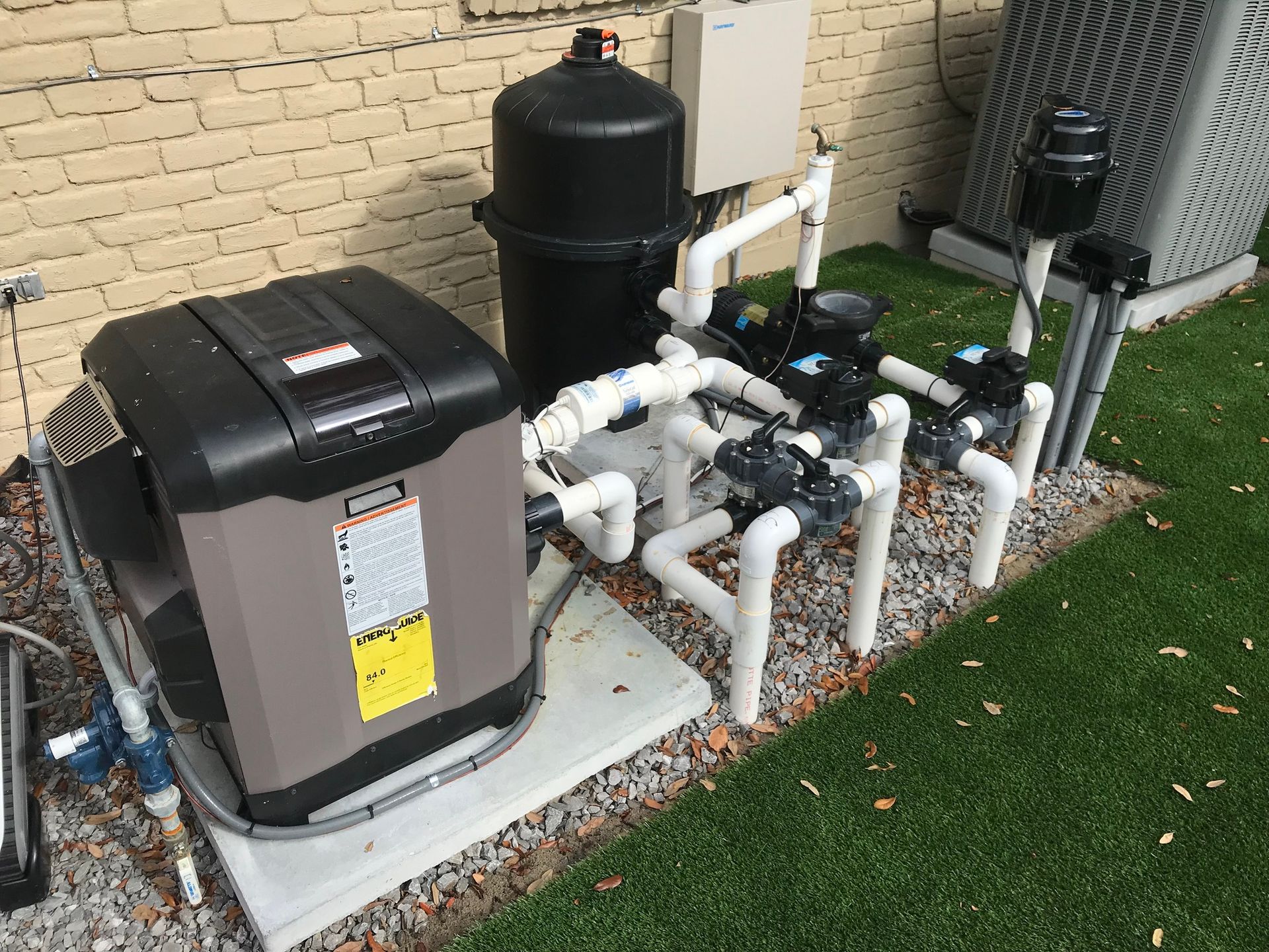 Pool pump and filtration system setup inside utility area in Destrehan, LA