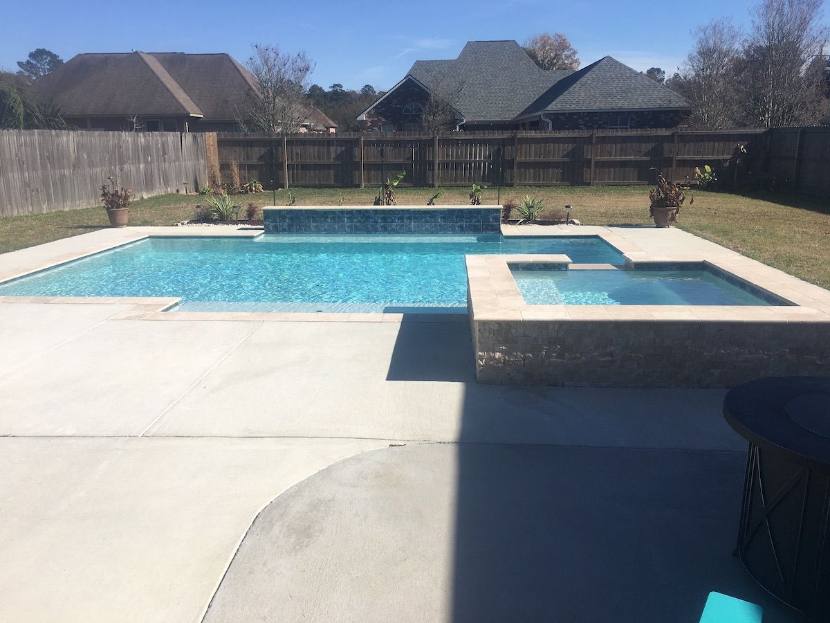 Modern in-ground pool with spa in backyard, Kenner LA