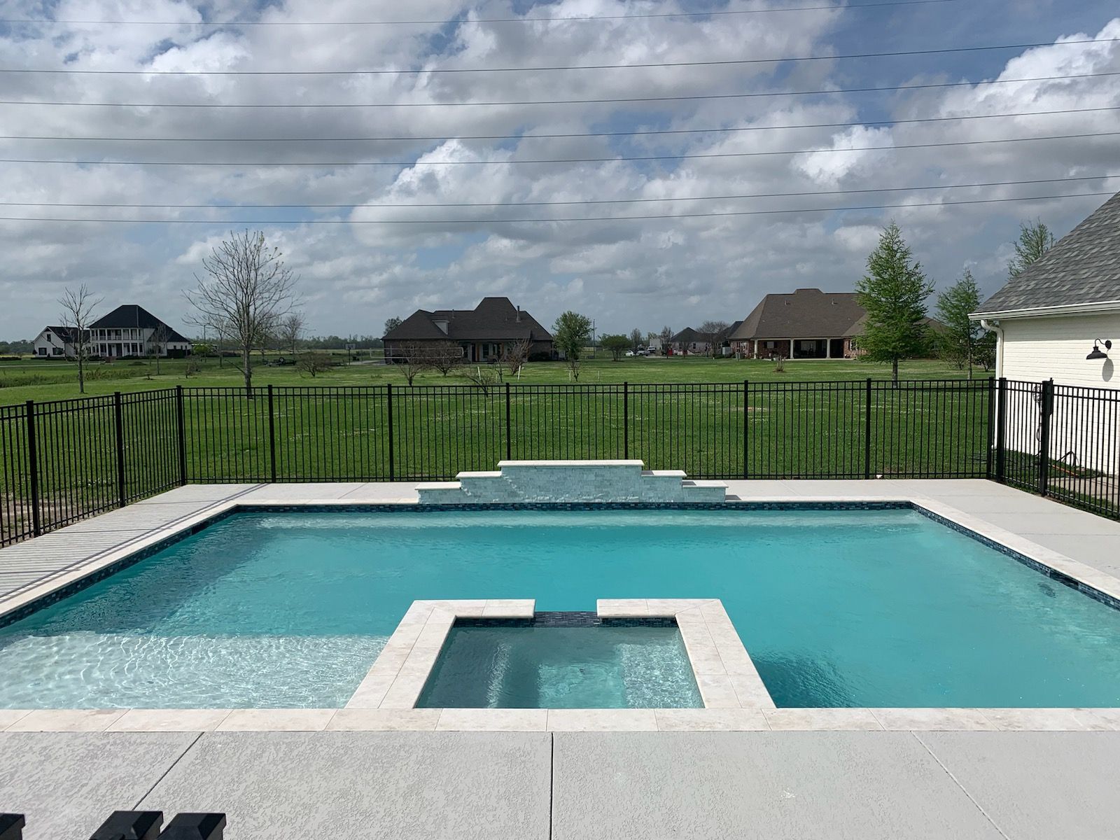 Contemporary in-ground pool with spa in the center in LaPlace,LA