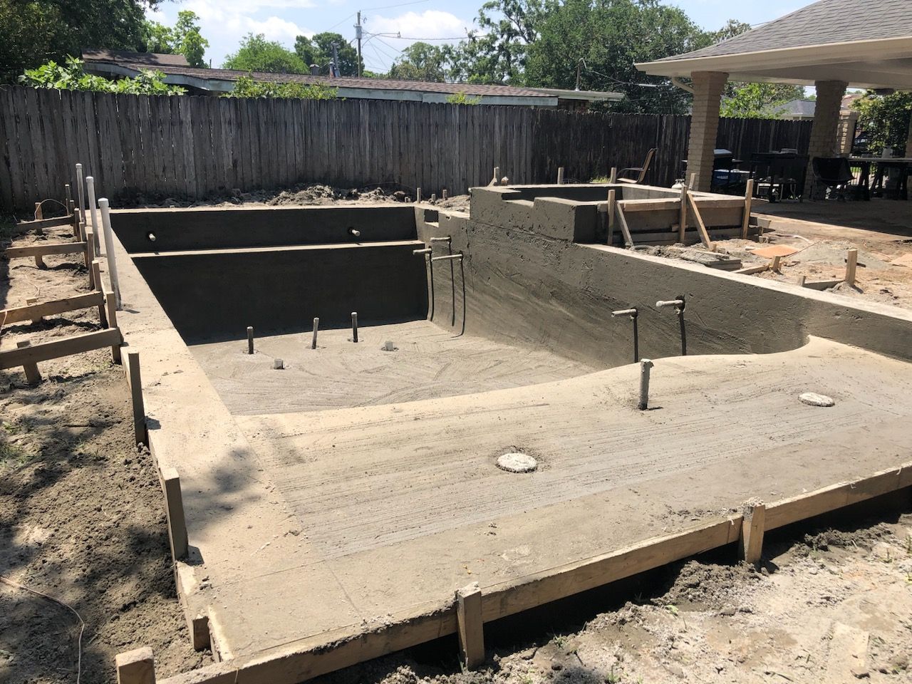 Gunite pool under construction with steel rebar frame in Kenner, LA
