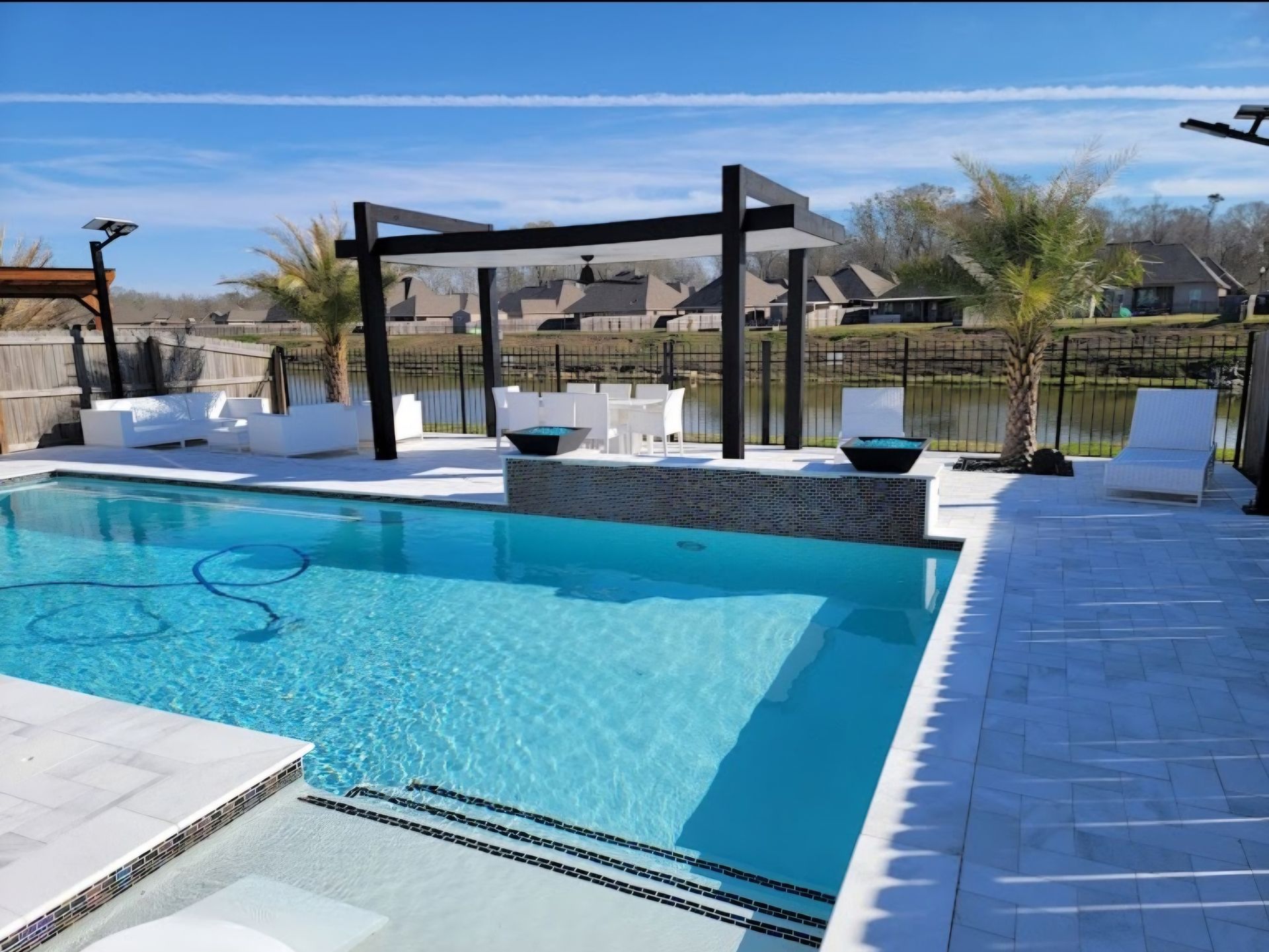 Backyard pool with pergola and palm trees, Metairie, LA