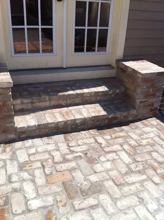 Brick poolside steps leading to a house in Abita Springs. LA