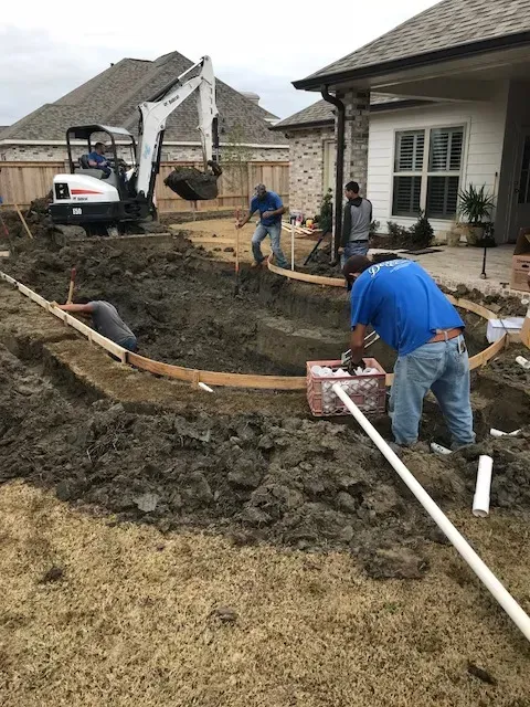 Excavation underway for pool foundation in backyard of Norco, LA home