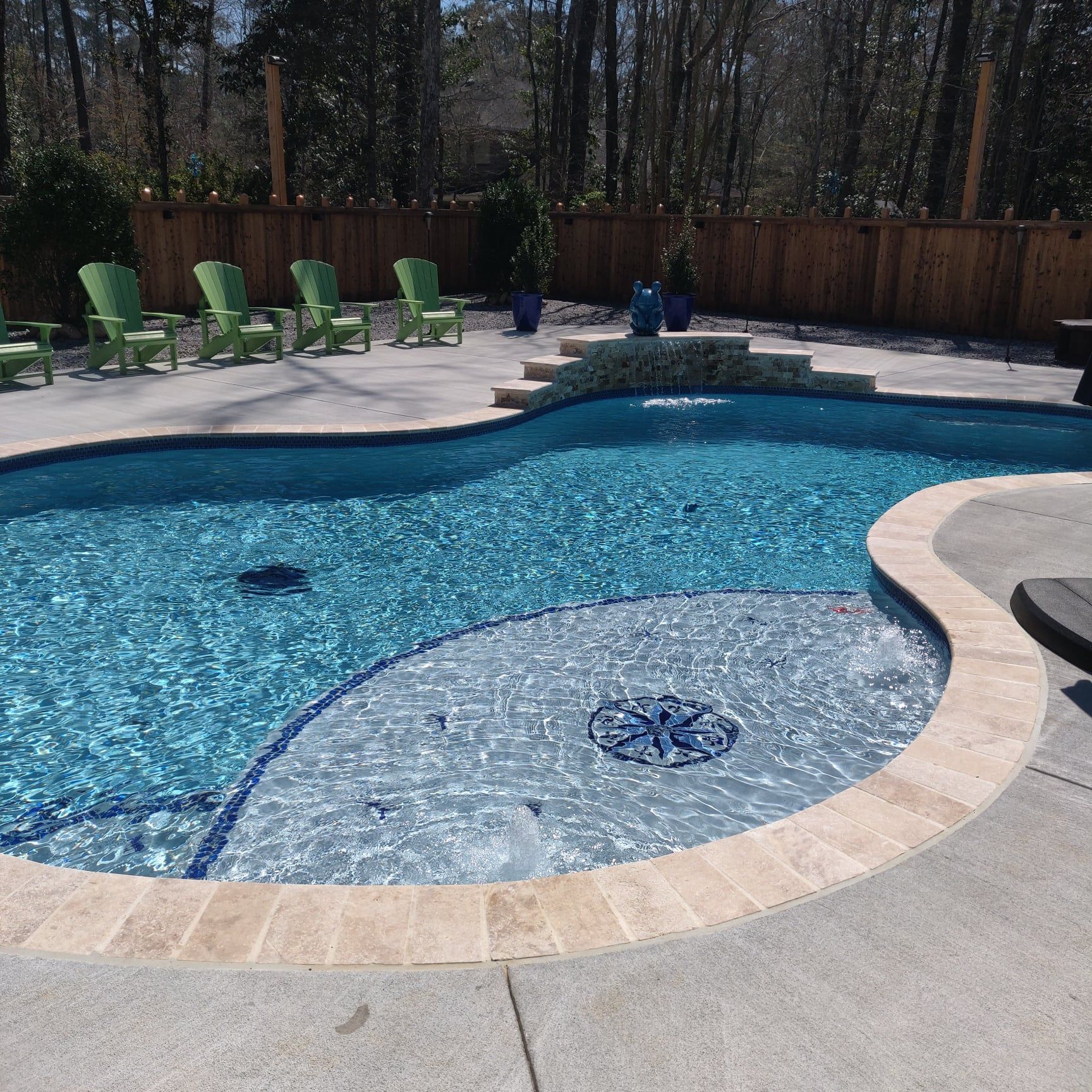 A large swimming pool with green chairs around it, New Orleans area