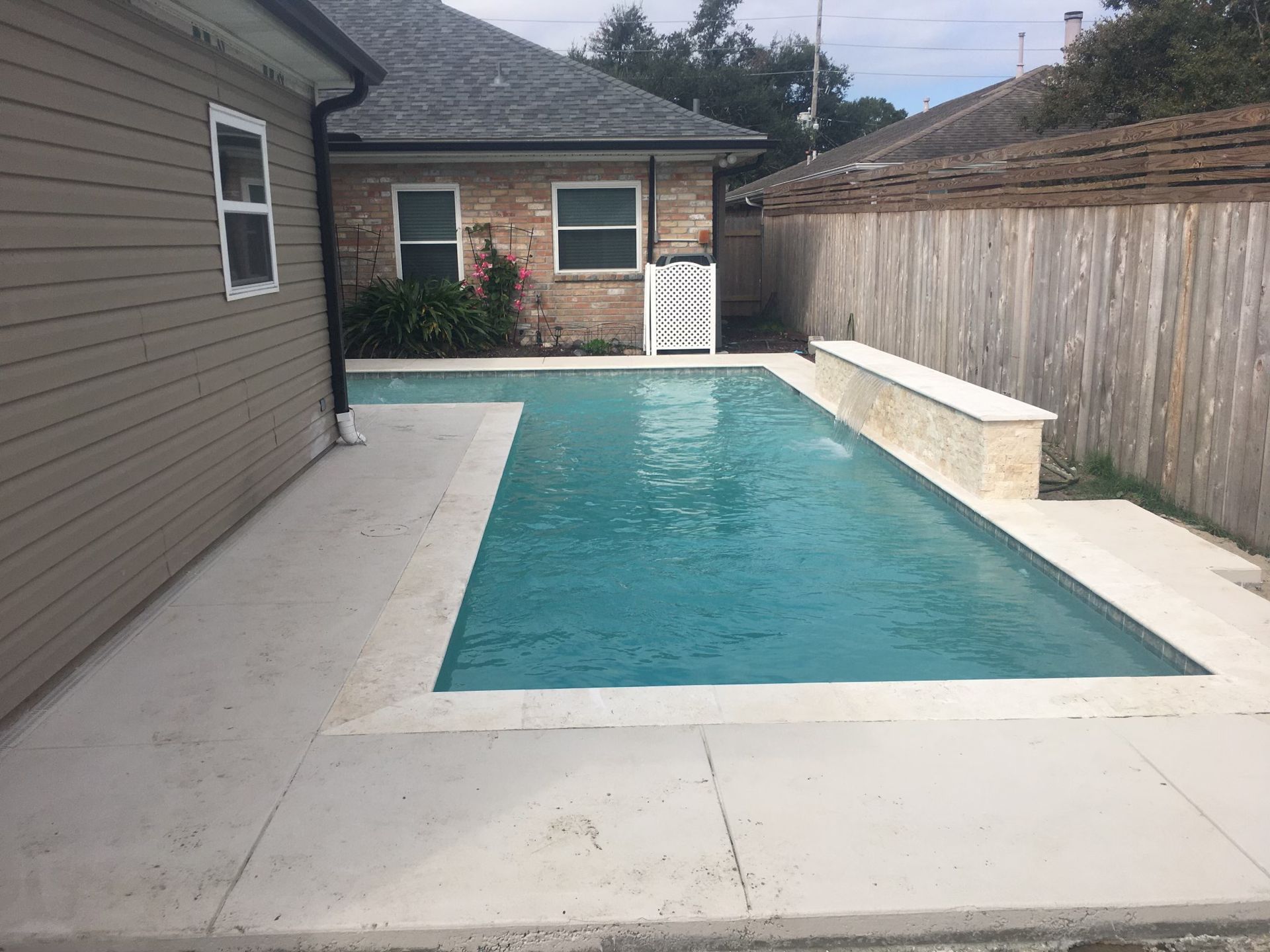 Long backyard lap pool next to home in Houma, LA