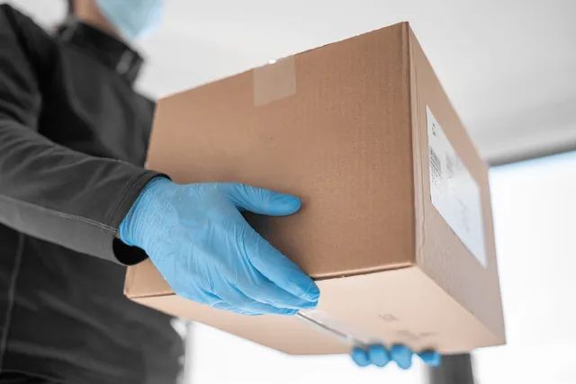 Learn More About Donations man holding a box of donation