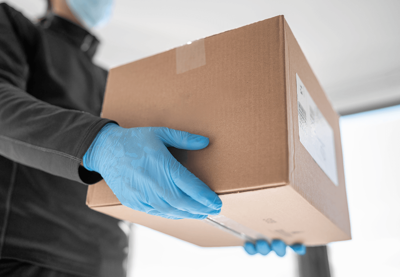 Learn More About Donations man holding a box of donation