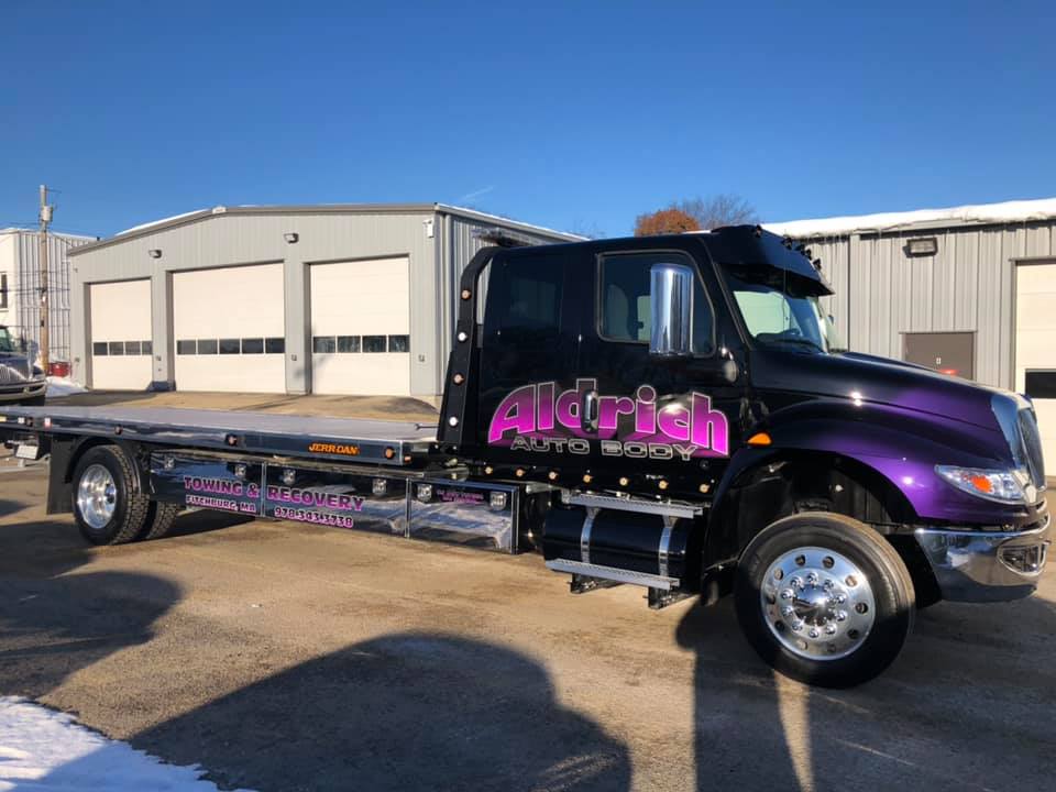 Towing truck near the storage units