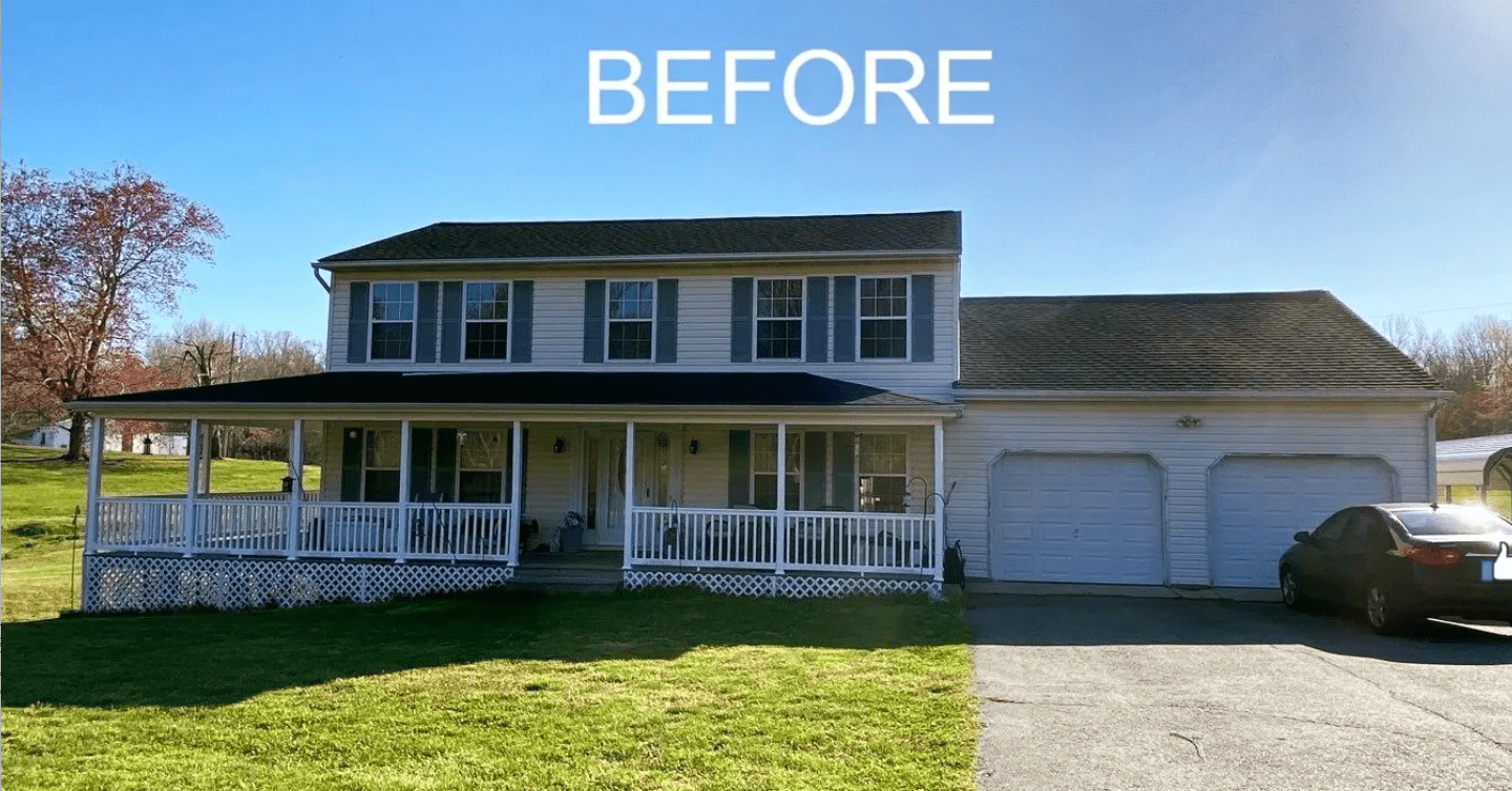 Before photo of a two-story white house with a porch, attached garage, lawn, and driveway under a blue sky