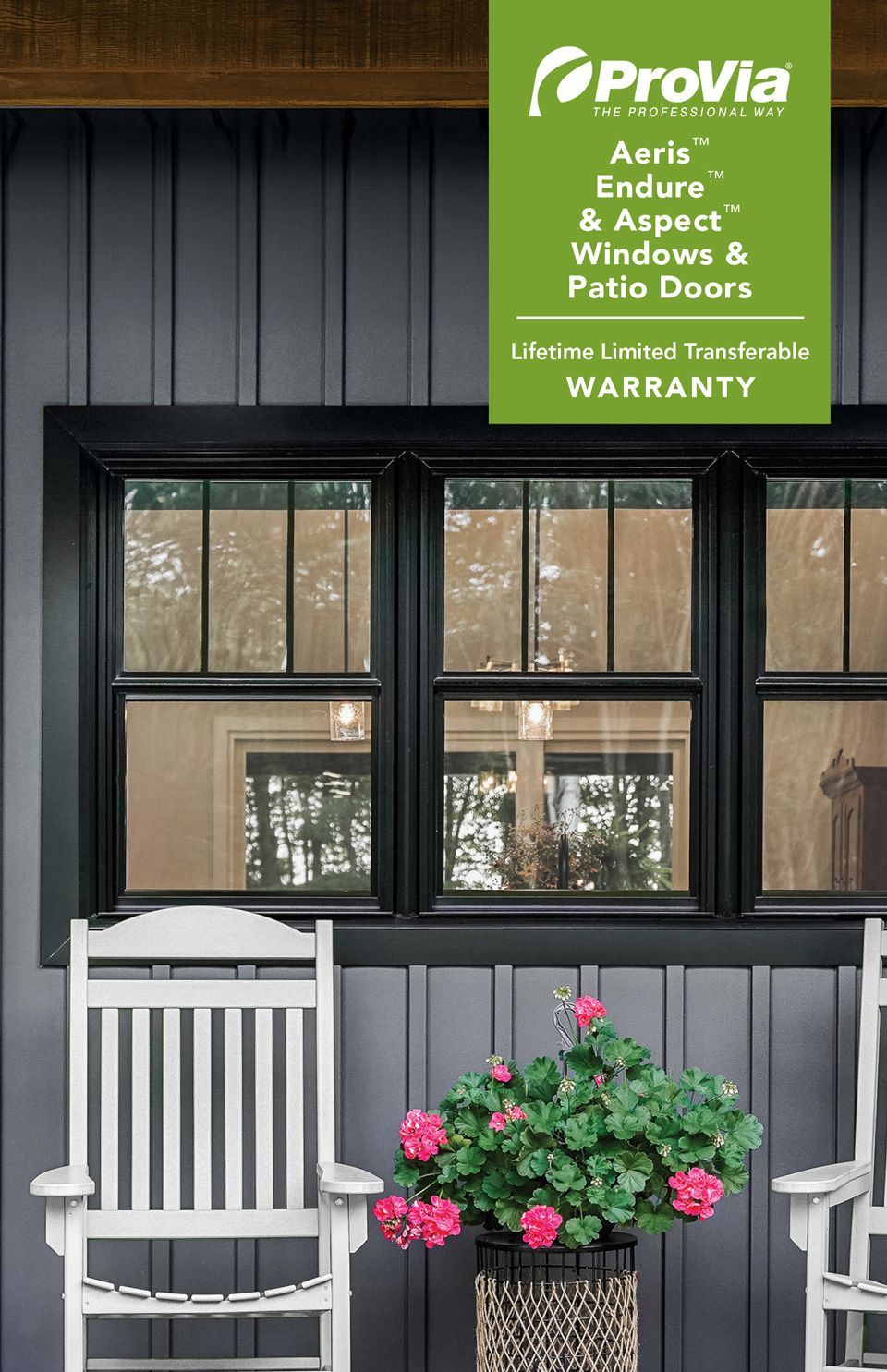 ProVia sign above black-framed porch windows, with white rocking chair and pink flowers below