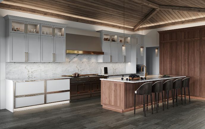 A modern kitchen featuring white cabinets, a wood-paneled island with bar stools, marble backsplash, and vaulted ceilings.