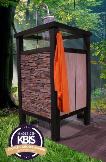 An outdoor shower with stone walls and wood doors, featuring an orange towel and a
