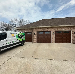 White garage door with the number 560 above it, and decorative horseshoes.