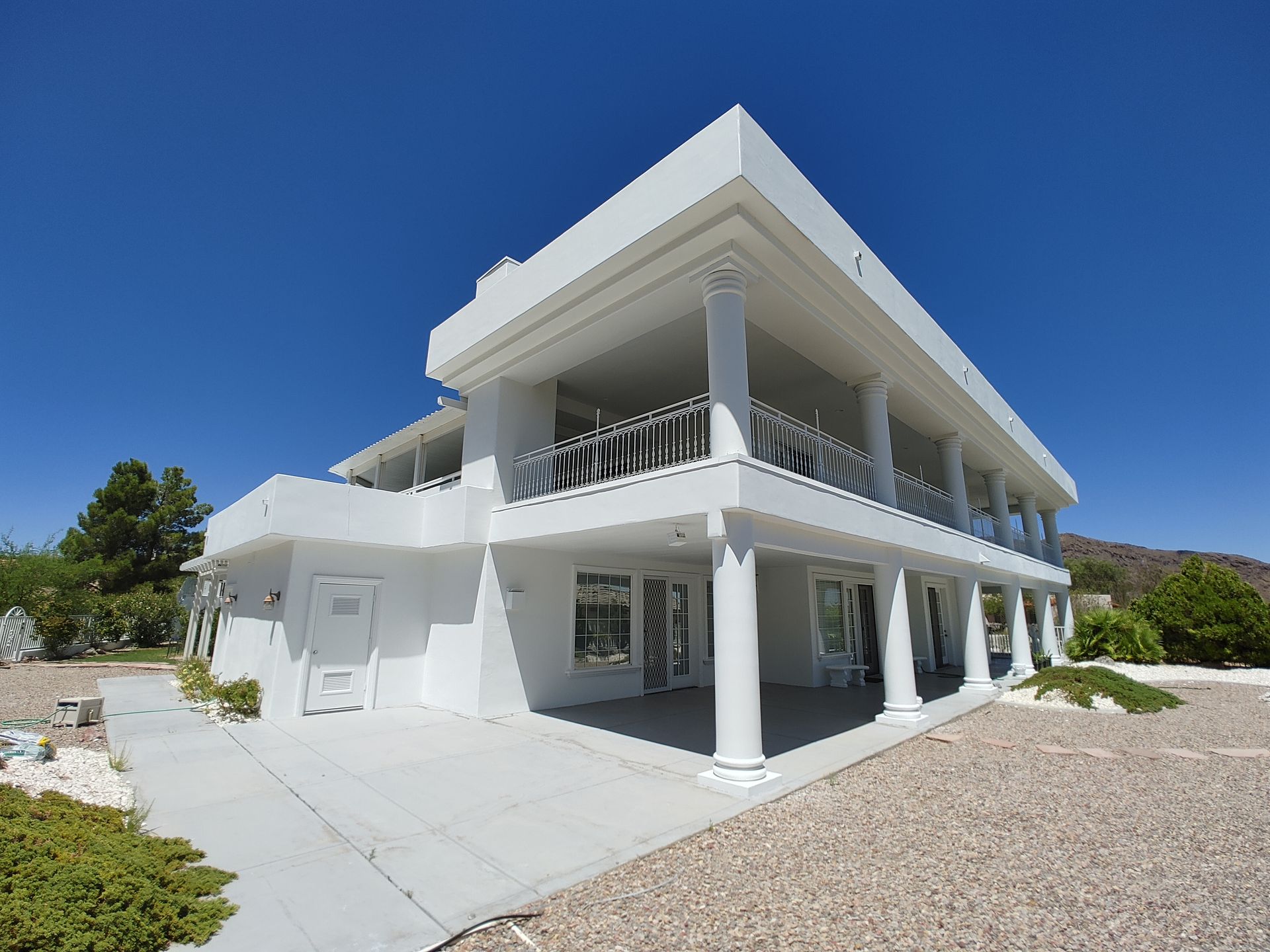 A large white house with columns and a balcony
