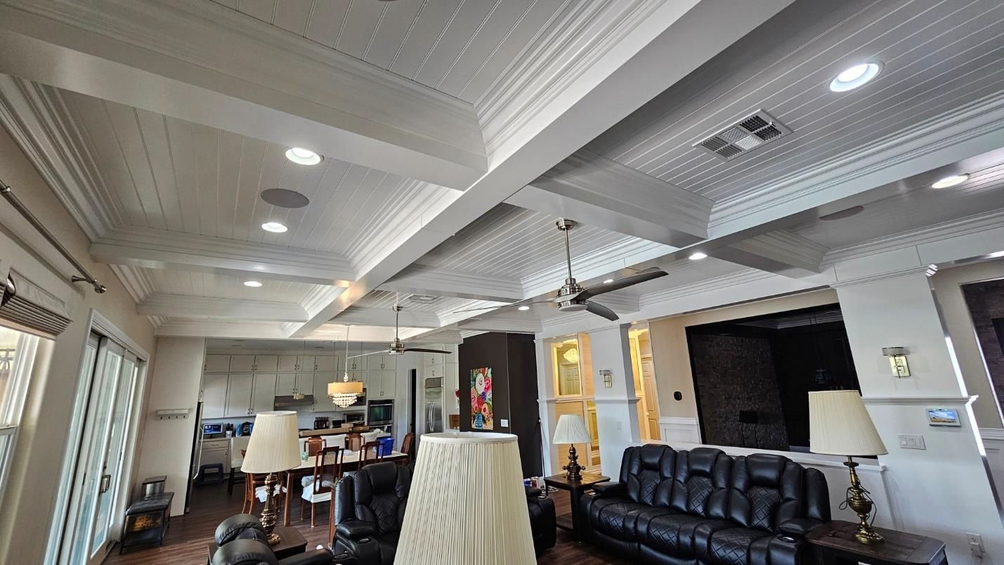 A living room filled with furniture and a ceiling fan.