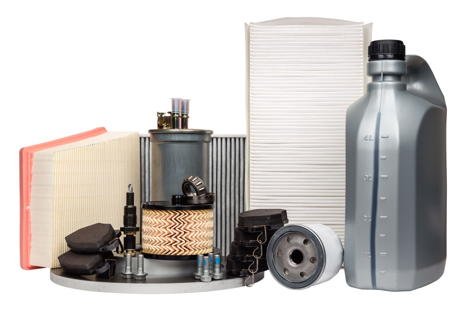 Assorted car maintenance parts: air filters, oil filter, spark plugs, and motor oil bottle