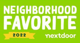 a green sign that says neighborhood favorite 2022 nextdoor