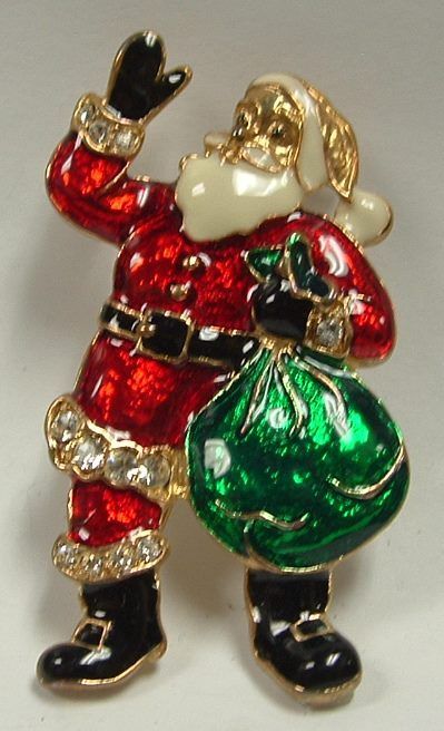 Enamel Santa Claus brooch in red suit with a green gift bag, waving.