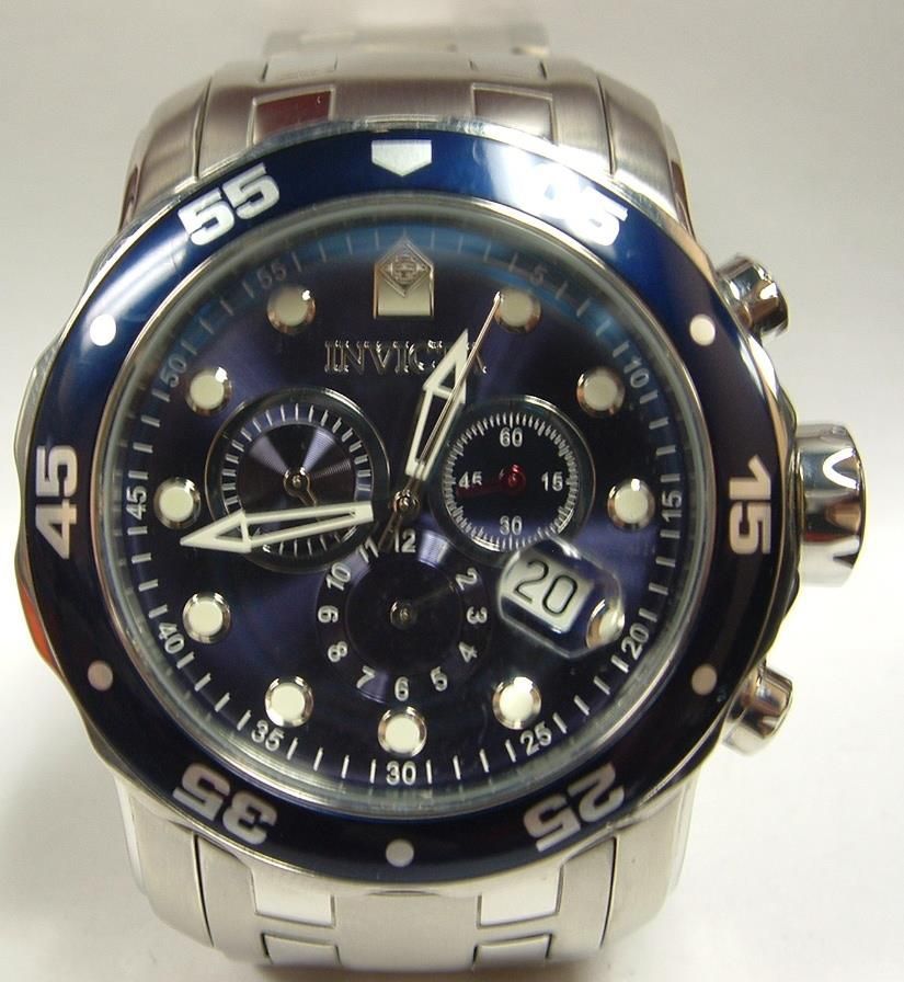 Close-up of a stainless steel Invicta watch with a blue face, white markings, and a blue rotating bezel.