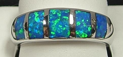 Silver ring with rectangular blue and green opals.