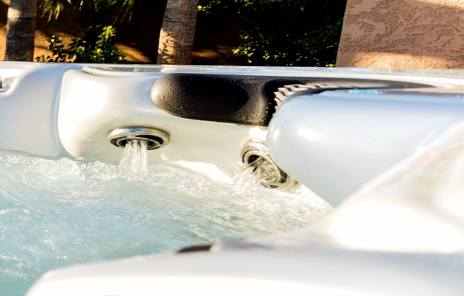 A close up of a hot tub with water coming out of it